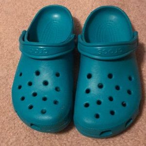 Teal crocs size 7